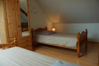 La chambre bleue avec 2 lits pour une personne